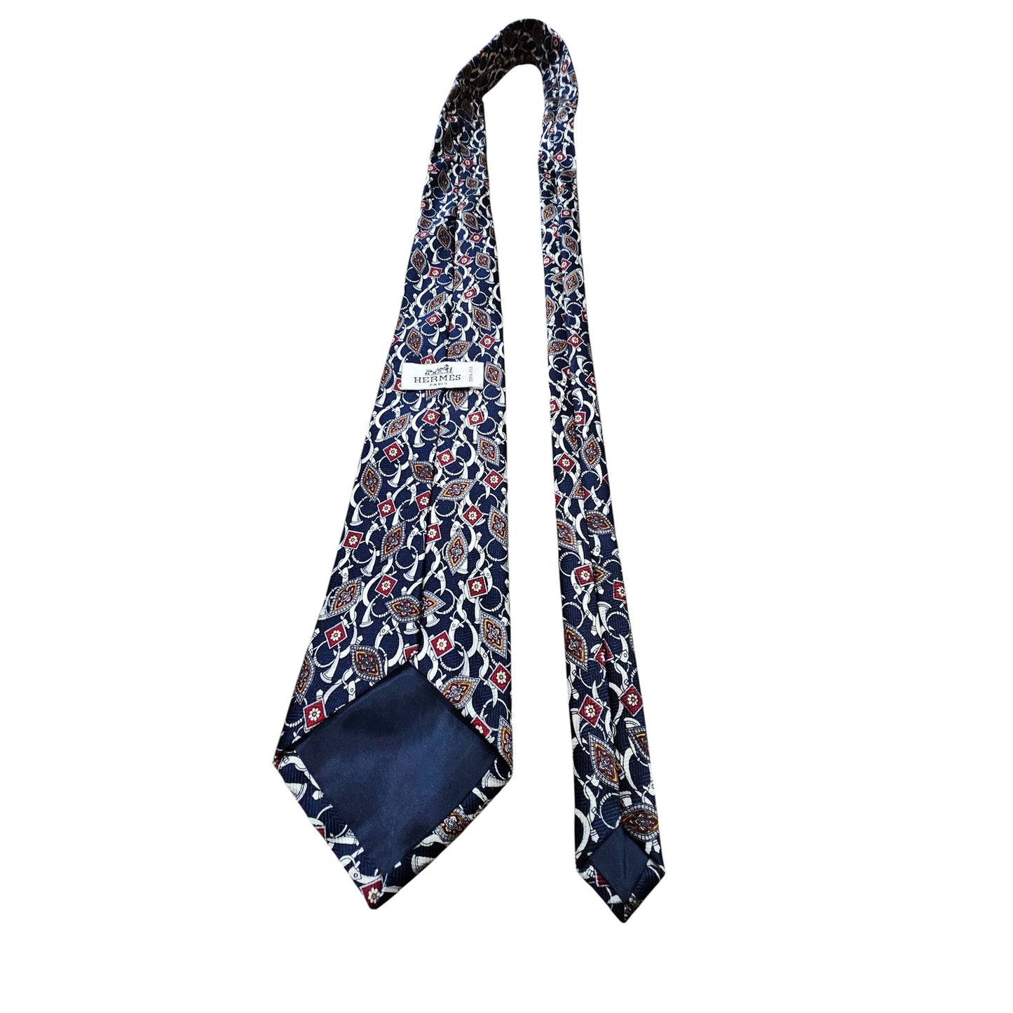 Hermès silk tie with a classic geometric pattern in navy blue, red, and white tones