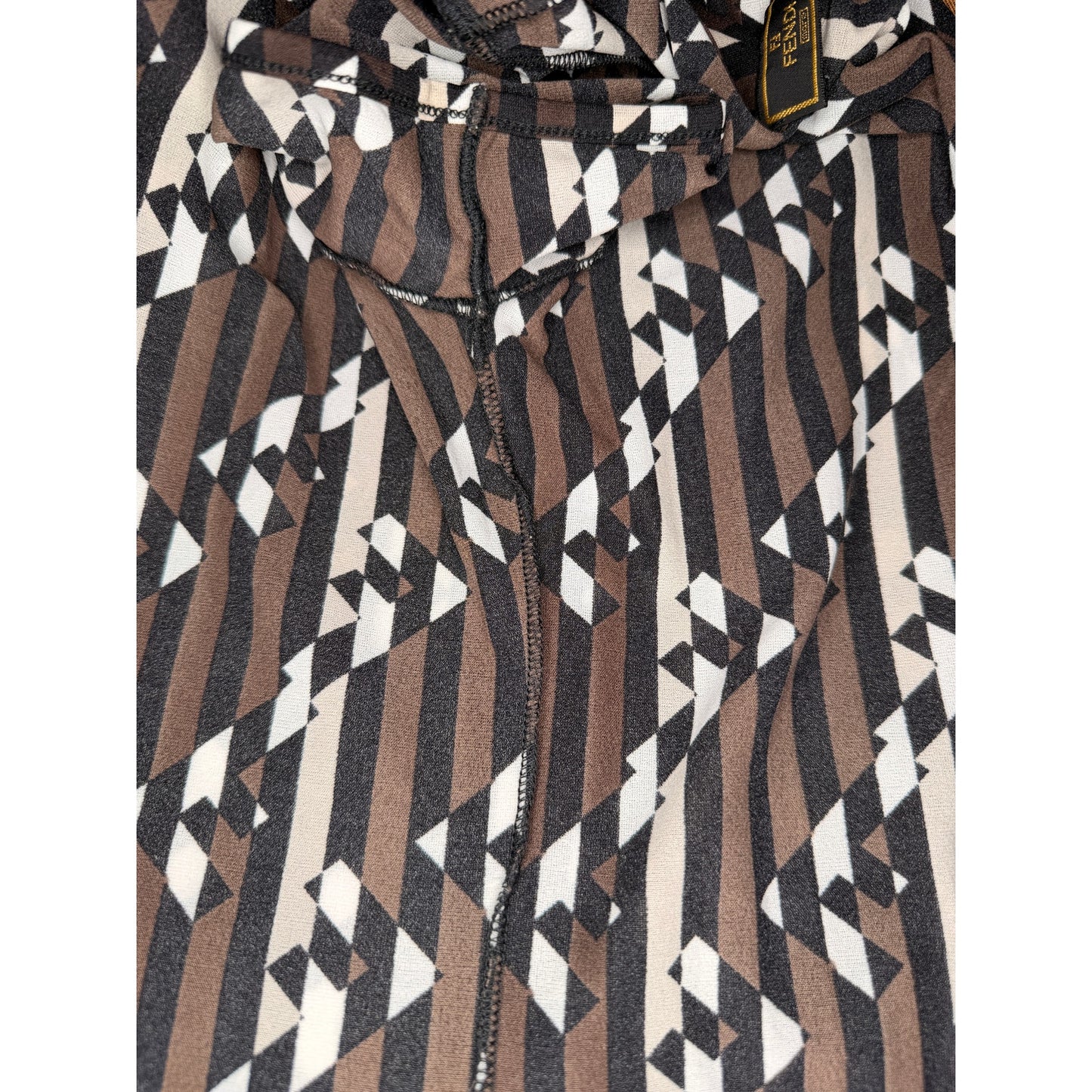 Fendi vintage 1990s T-shirt features a vertical Zucca FF logo pattern in brown, black, and white