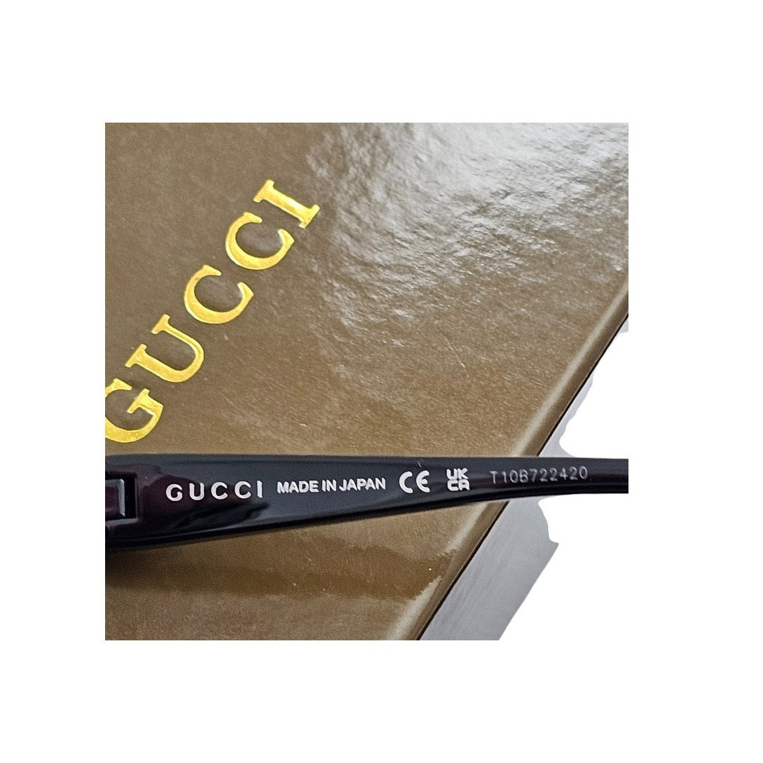 Gucci GG1650S 002 shield mask sunglass with a shiny black frame and pink bio-nylon lens