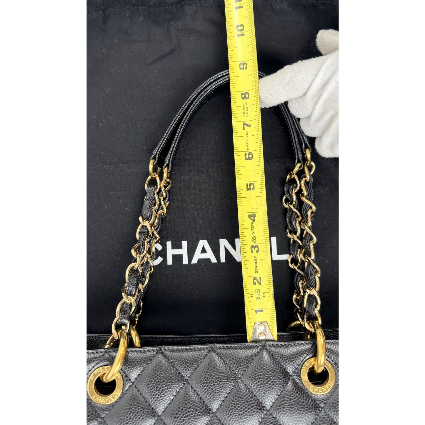Chanel Grand Shopping Tote (GST) bag in black caviar leather with gold-tone hardware