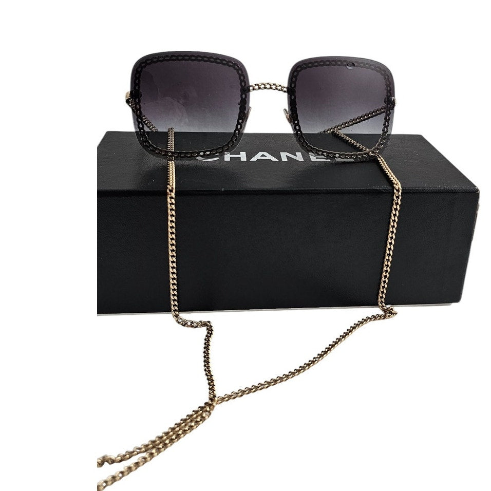Chanel CH4244 square metal frame sunglasses with a detachable gold-tone chain and grey gradient lenses