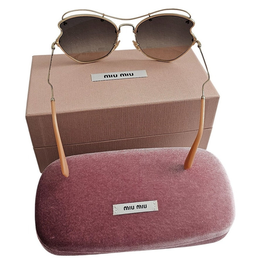 Miu Miu butterfly-style women's sunglasses with a pale gold-tone metal frame
