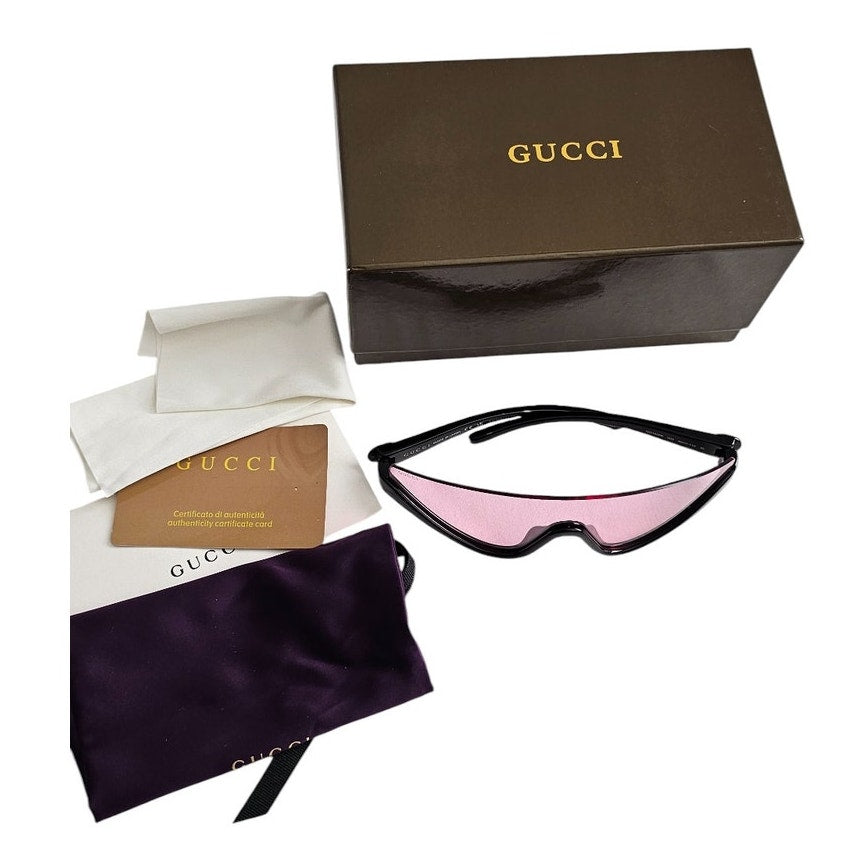 Gucci GG1650S 002 shield mask sunglass with a shiny black frame and pink bio-nylon lens