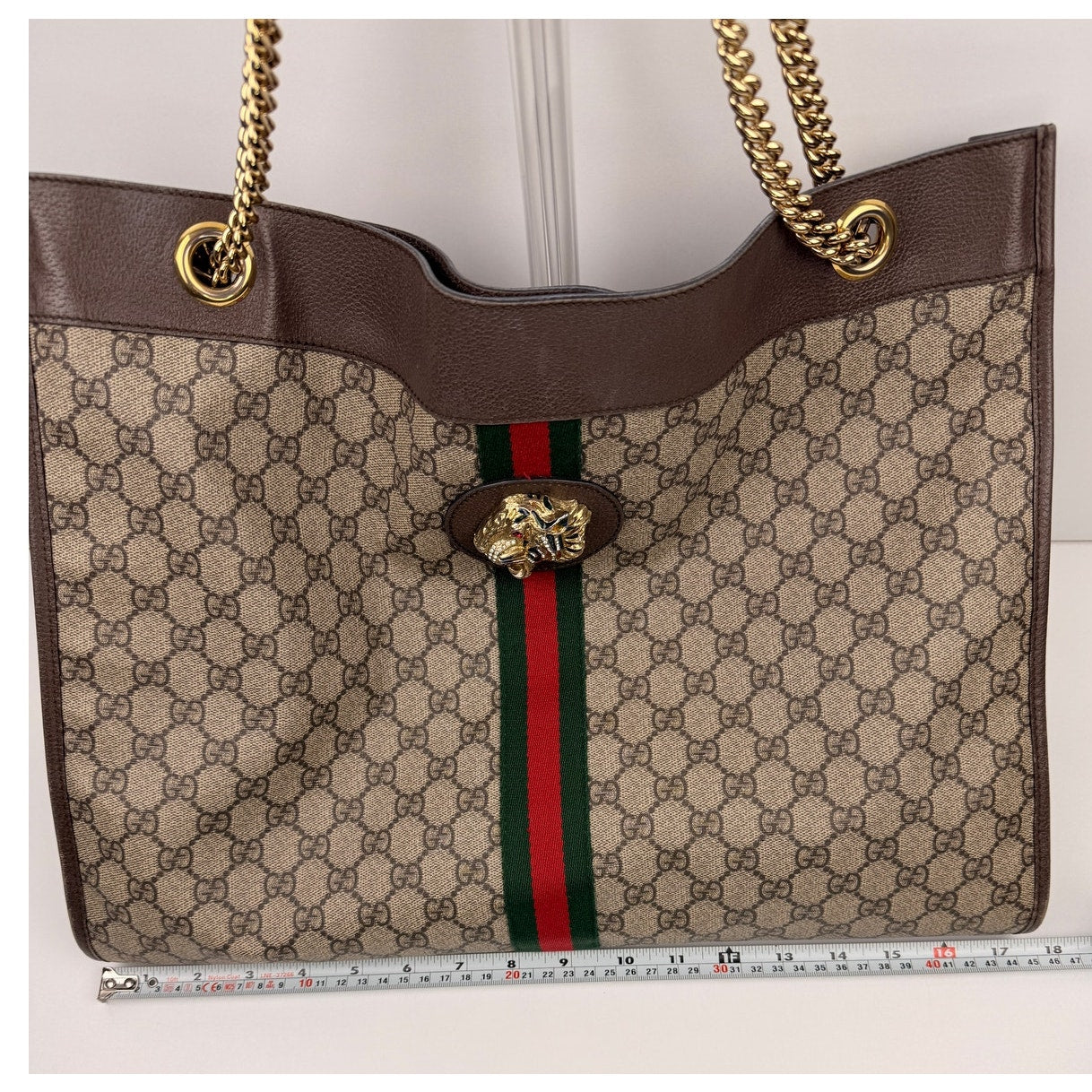 Gucci Rajah Large Tote Bag in GG Supreme canvas, featuring a tiger head detail and chain straps