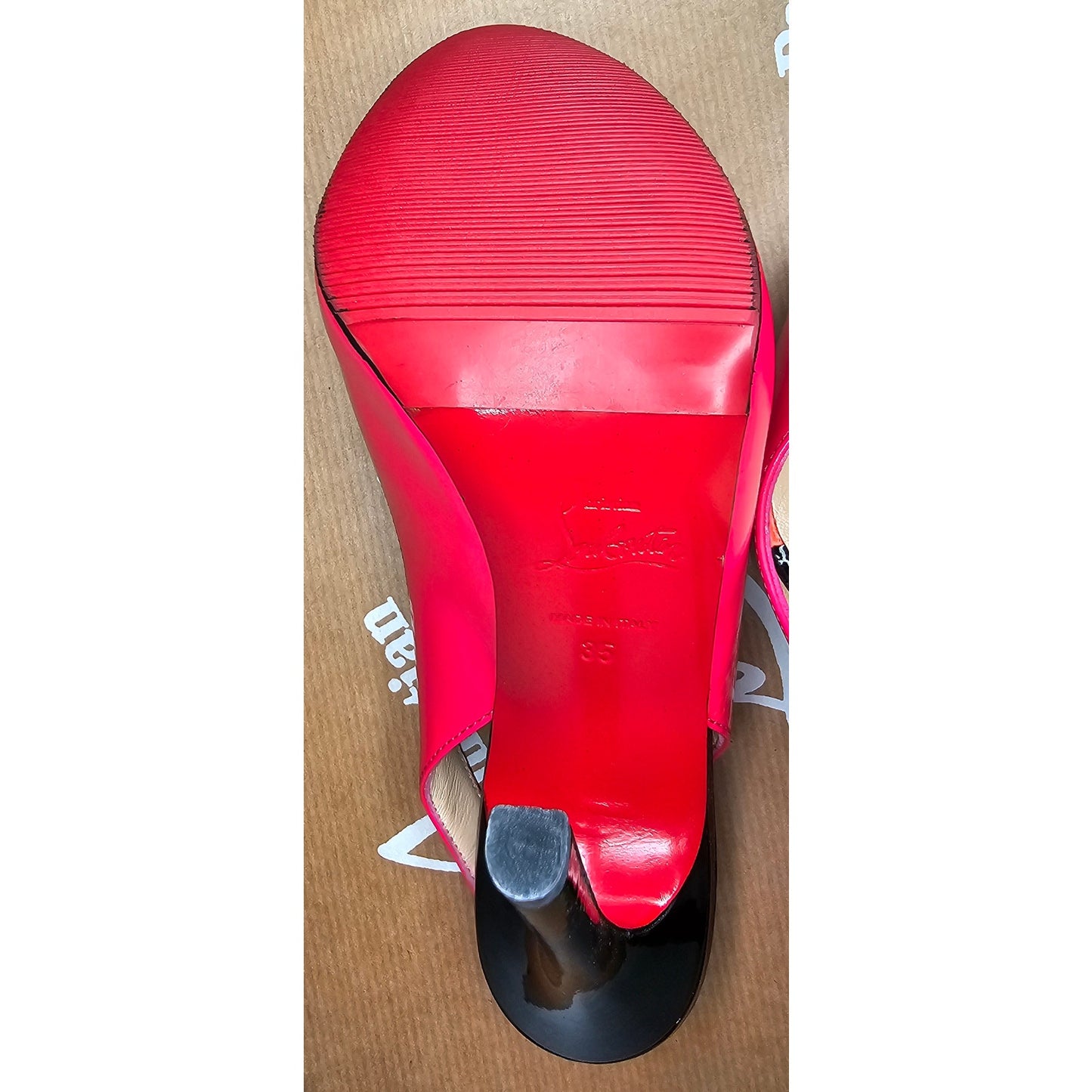 Christian Louboutin Flo slingback pump in hot pink patent leather with an orange platform and black heel