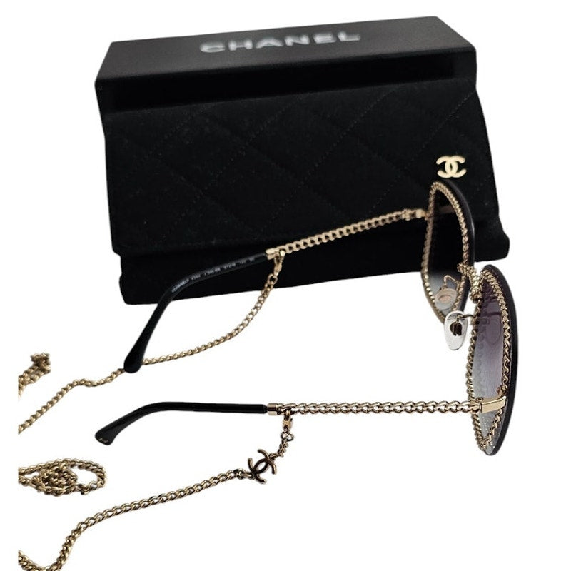 Chanel CH4244 square metal frame sunglasses with a detachable gold-tone chain and grey gradient lenses