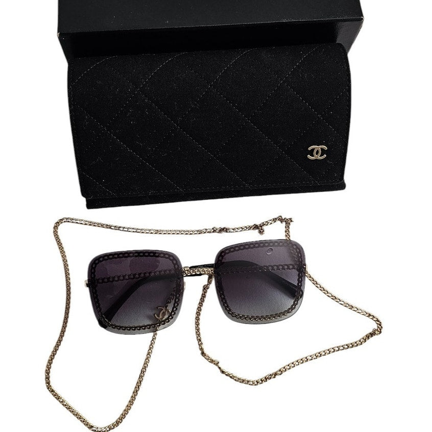 Chanel CH4244 square metal frame sunglasses with a detachable gold-tone chain and grey gradient lenses