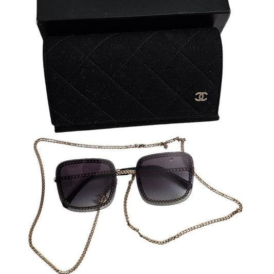 Chanel CH4244 square metal frame sunglasses with a detachable gold-tone chain and grey gradient lenses