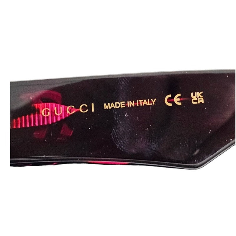Gucci GG1423O cat-eye eyeglasses in a fuchsia havana color