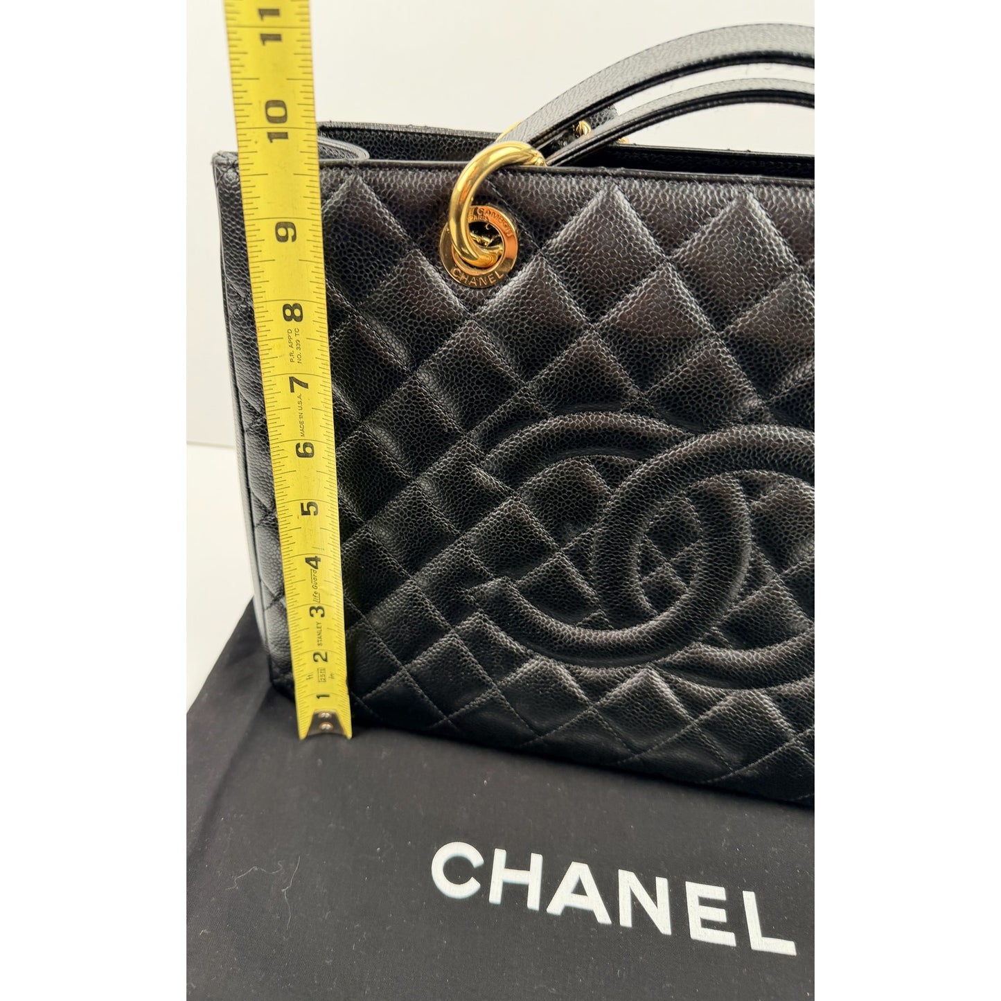 Chanel Grand Shopping Tote (GST) bag in black caviar leather with gold-tone hardware