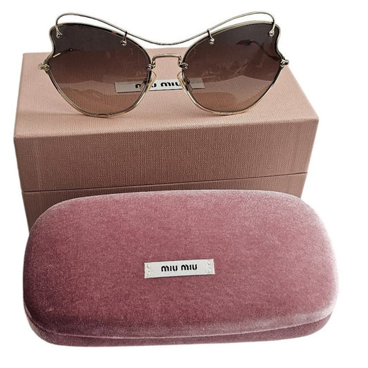 Miu Miu butterfly-style women's sunglasses with a pale gold-tone metal frame
