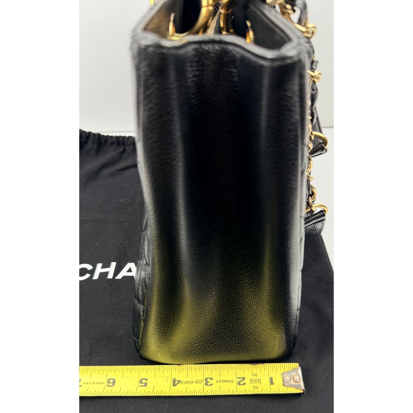 Chanel Grand Shopping Tote (GST) bag in black caviar leather with gold-tone hardware