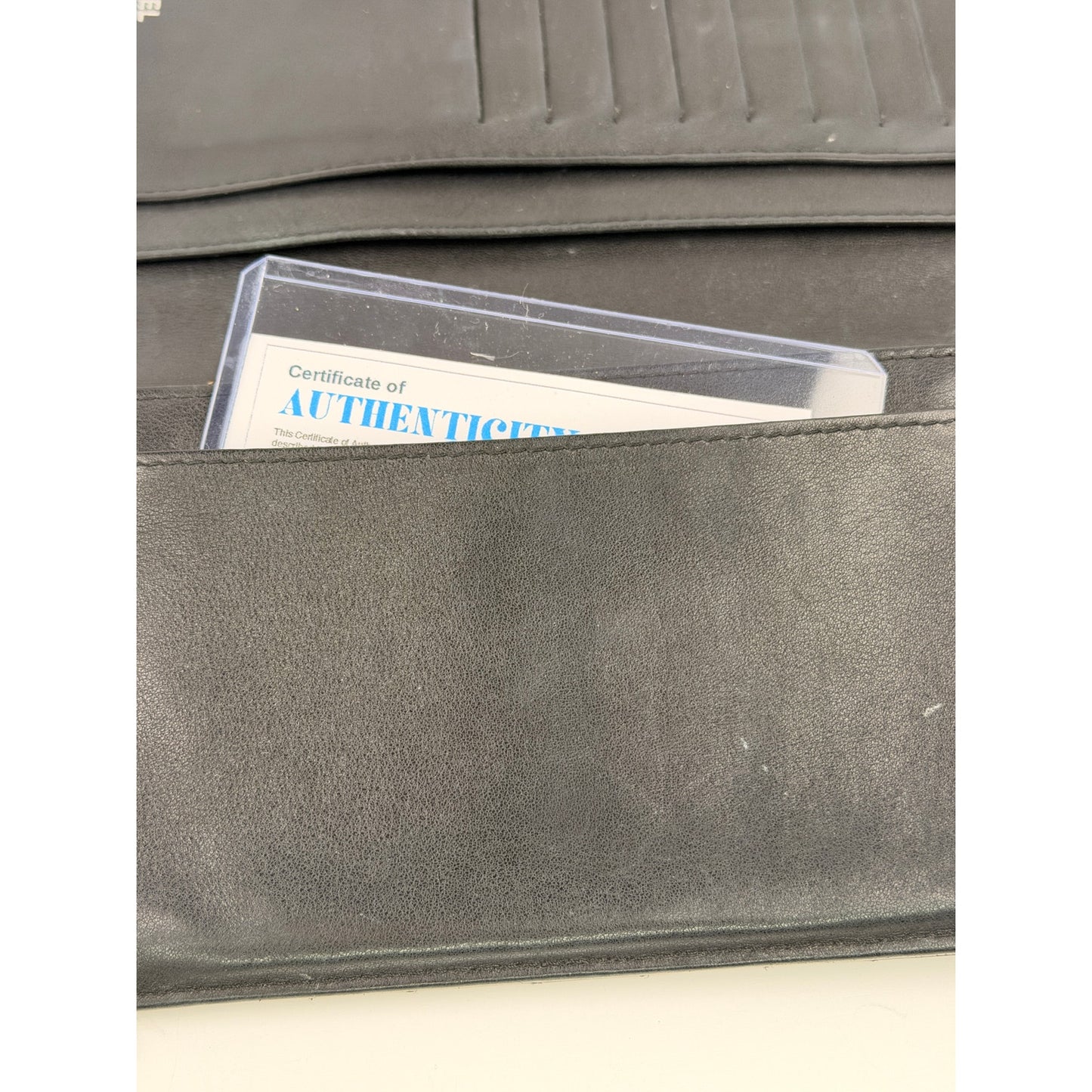 Chanel quilted patent leather long bifold wallet with a polished CC logo