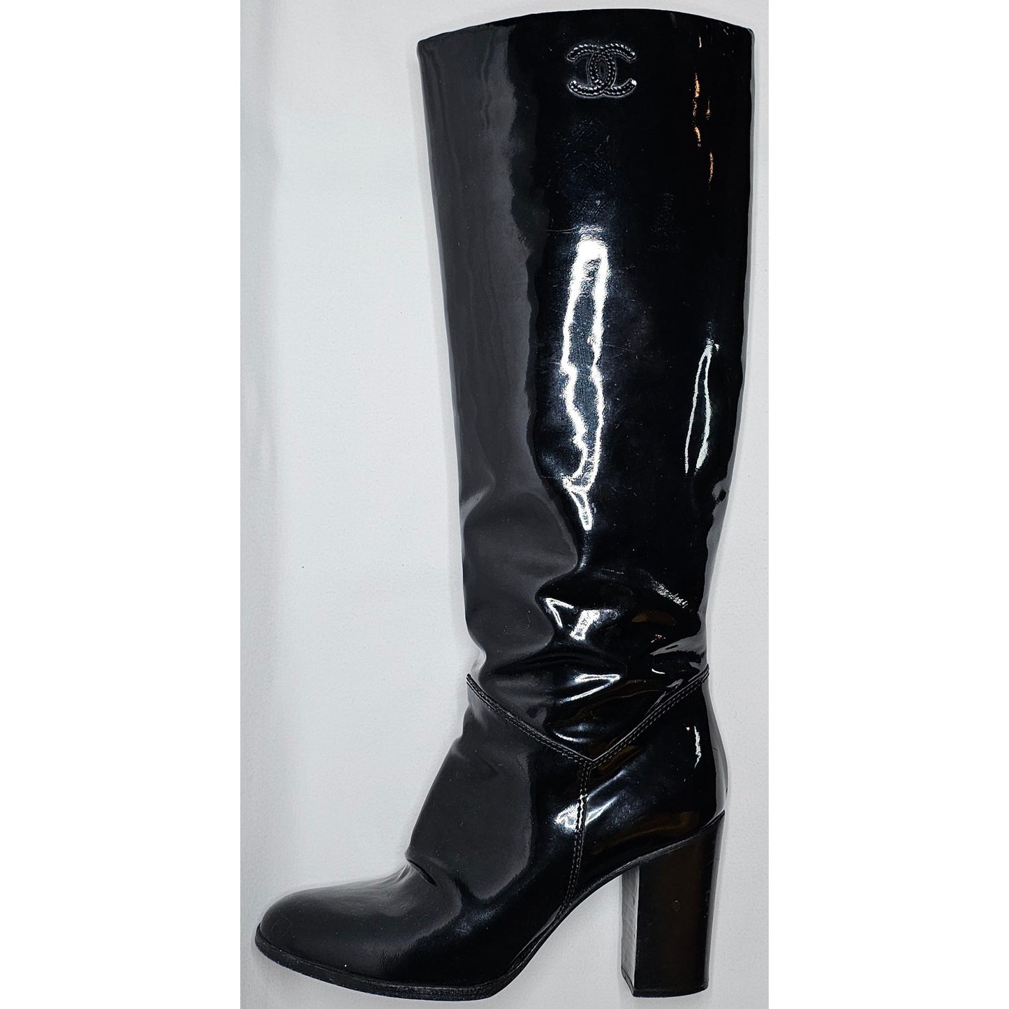 Chanel black patent leather boots with a chunky heel and embroidered CC logo