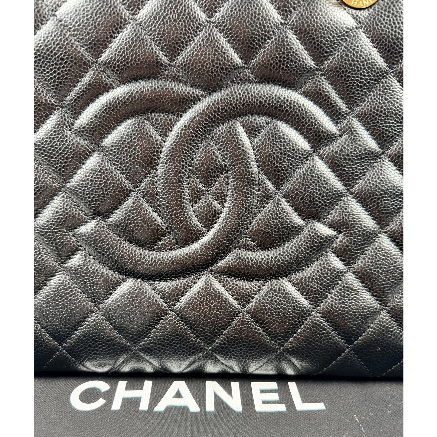 Chanel Grand Shopping Tote (GST) bag in black caviar leather with gold-tone hardware
