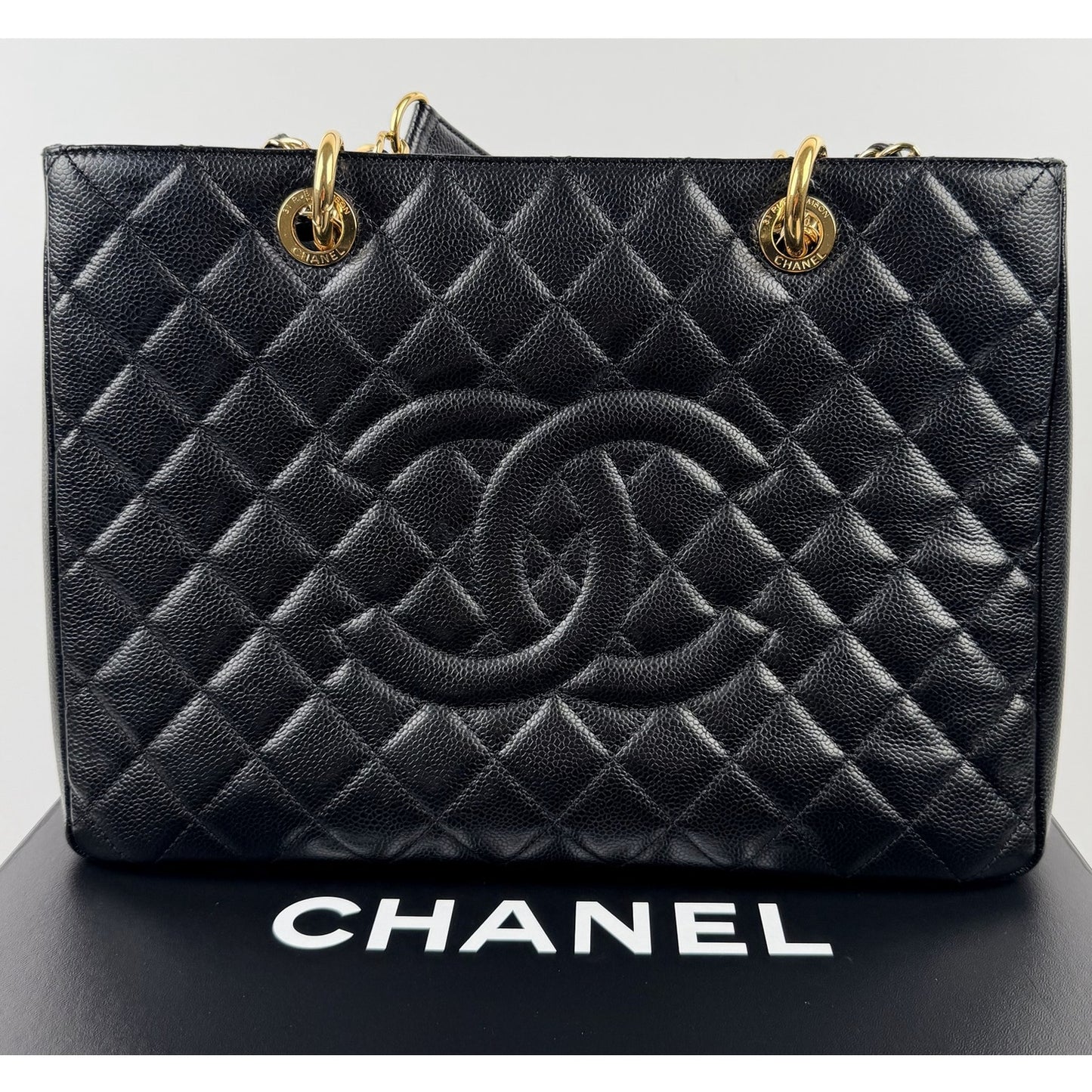 Chanel Grand Shopping Tote (GST) bag in black caviar leather with gold-tone hardware