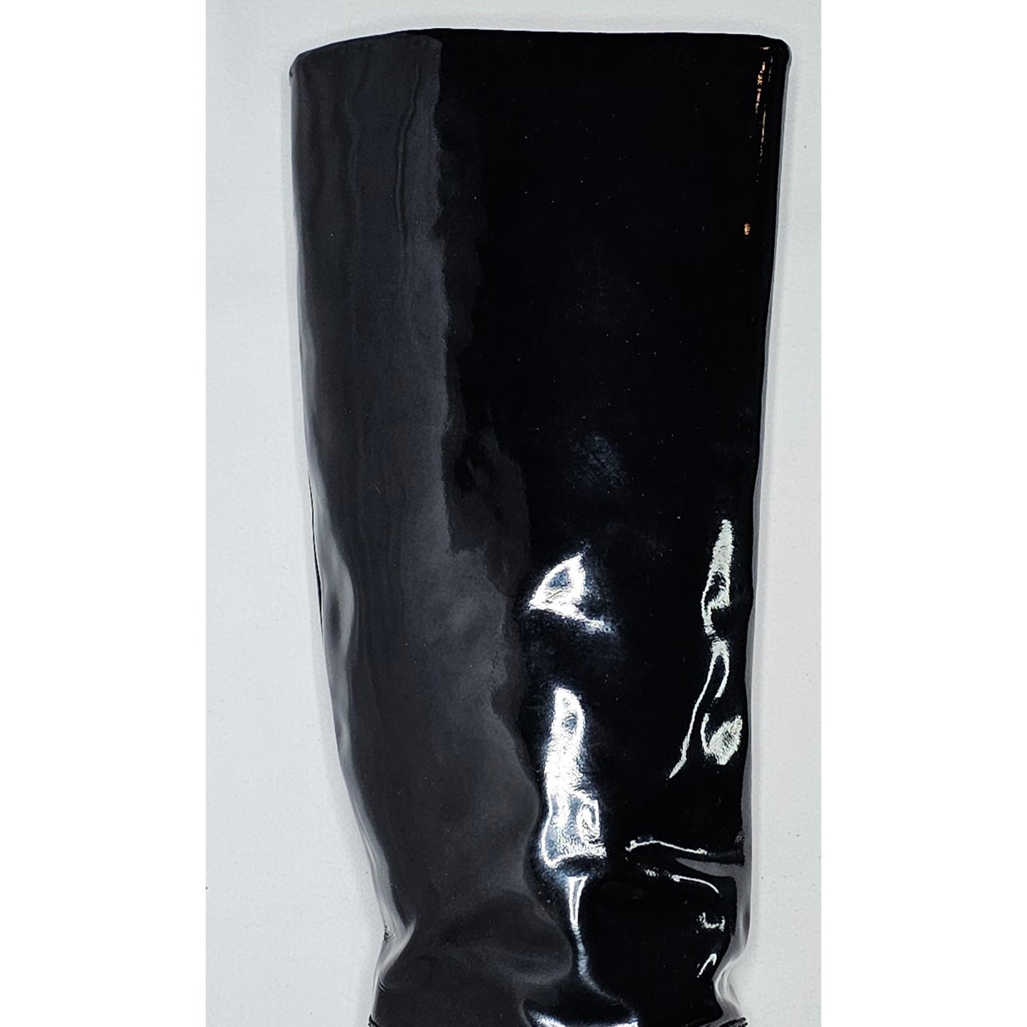Chanel black patent leather boots with a chunky heel and embroidered CC logo
