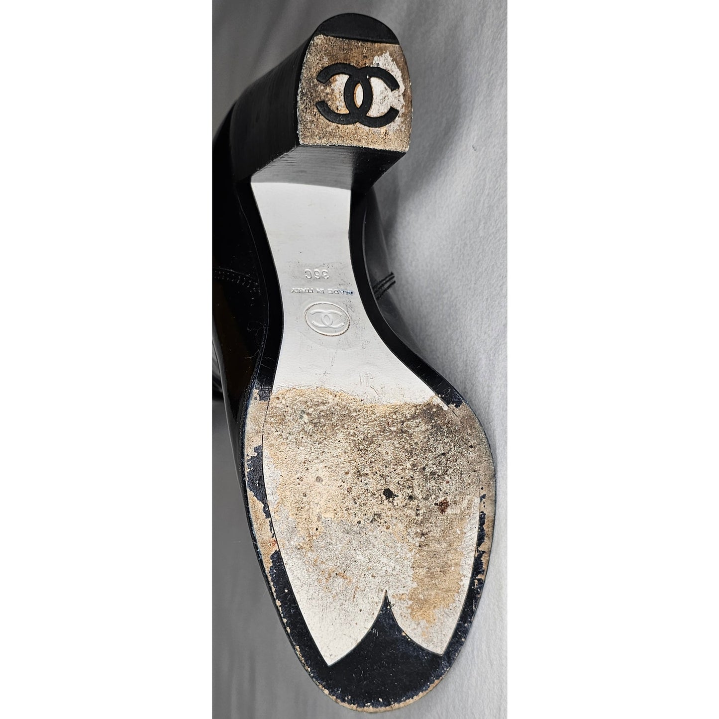 Chanel black patent leather boots with a chunky heel and embroidered CC logo