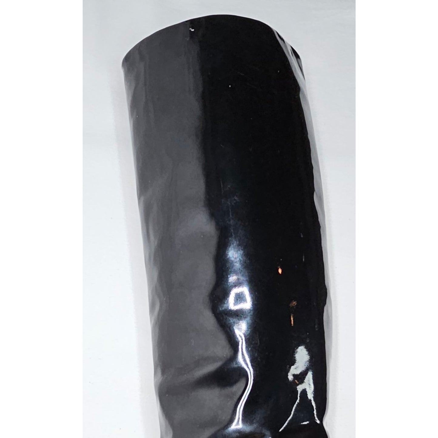 Chanel black patent leather boots with a chunky heel and embroidered CC logo