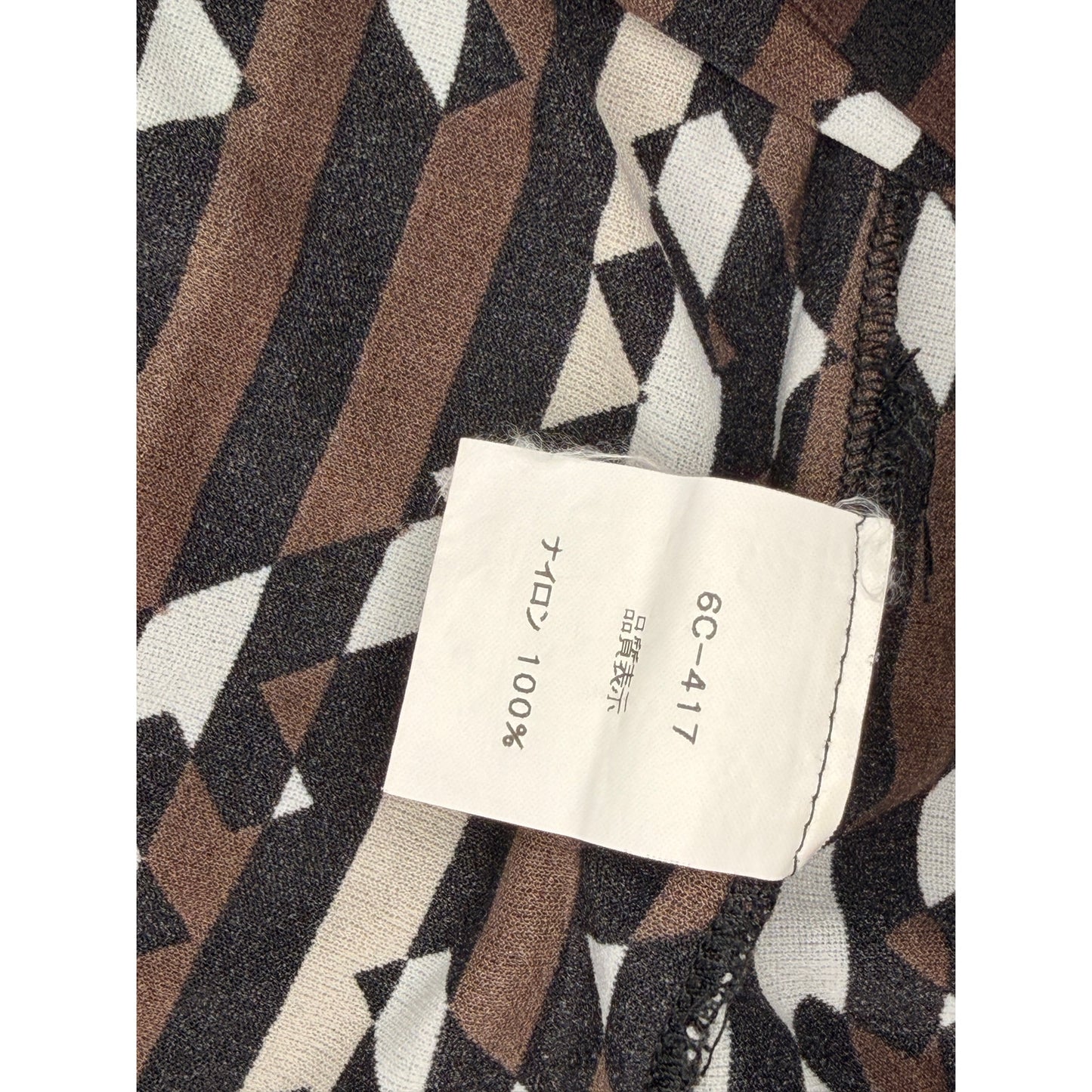 Fendi vintage 1990s T-shirt features a vertical Zucca FF logo pattern in brown, black, and white