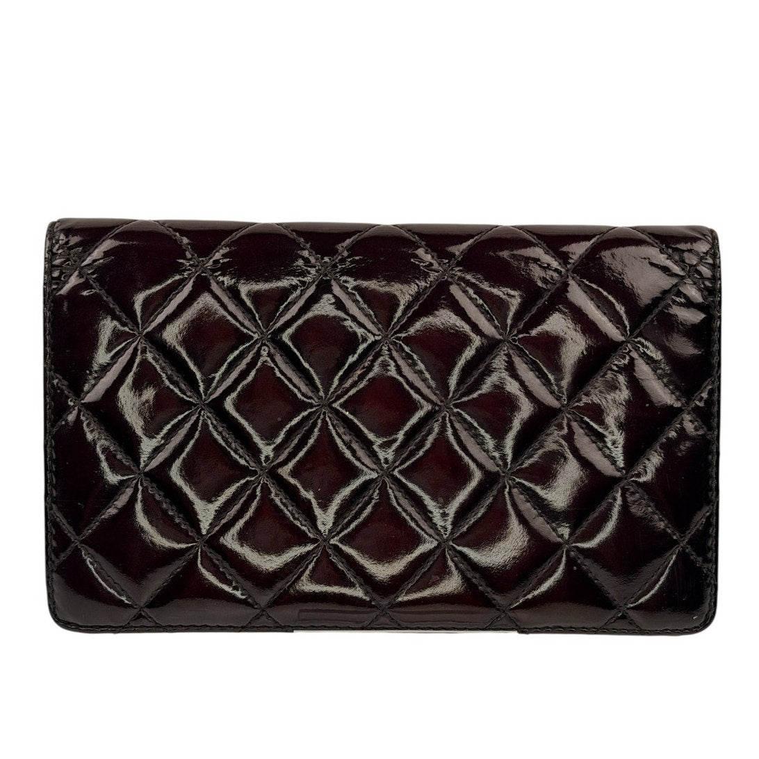 Chanel quilted patent leather long bifold wallet with a polished CC logo