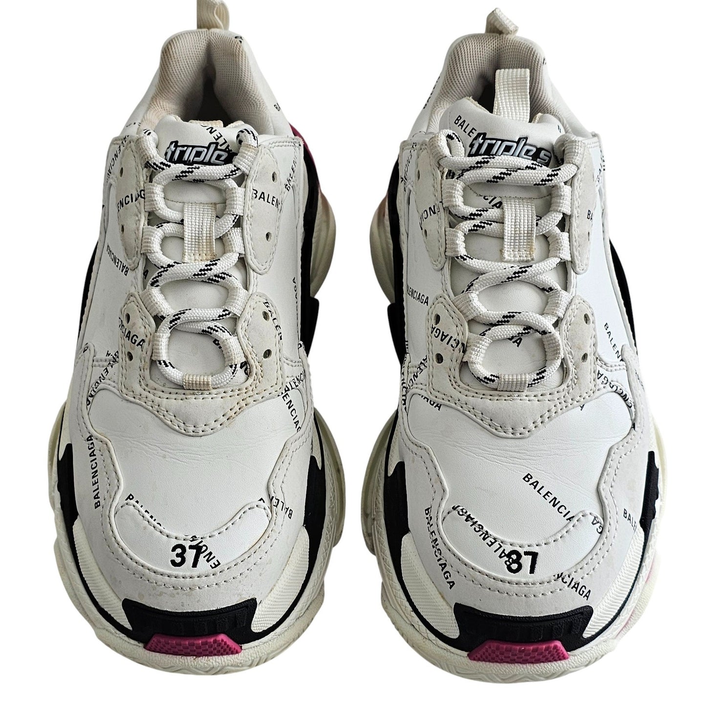 Balenciaga Triple S sneakers in white and black with pink accents and all-over logo detailing