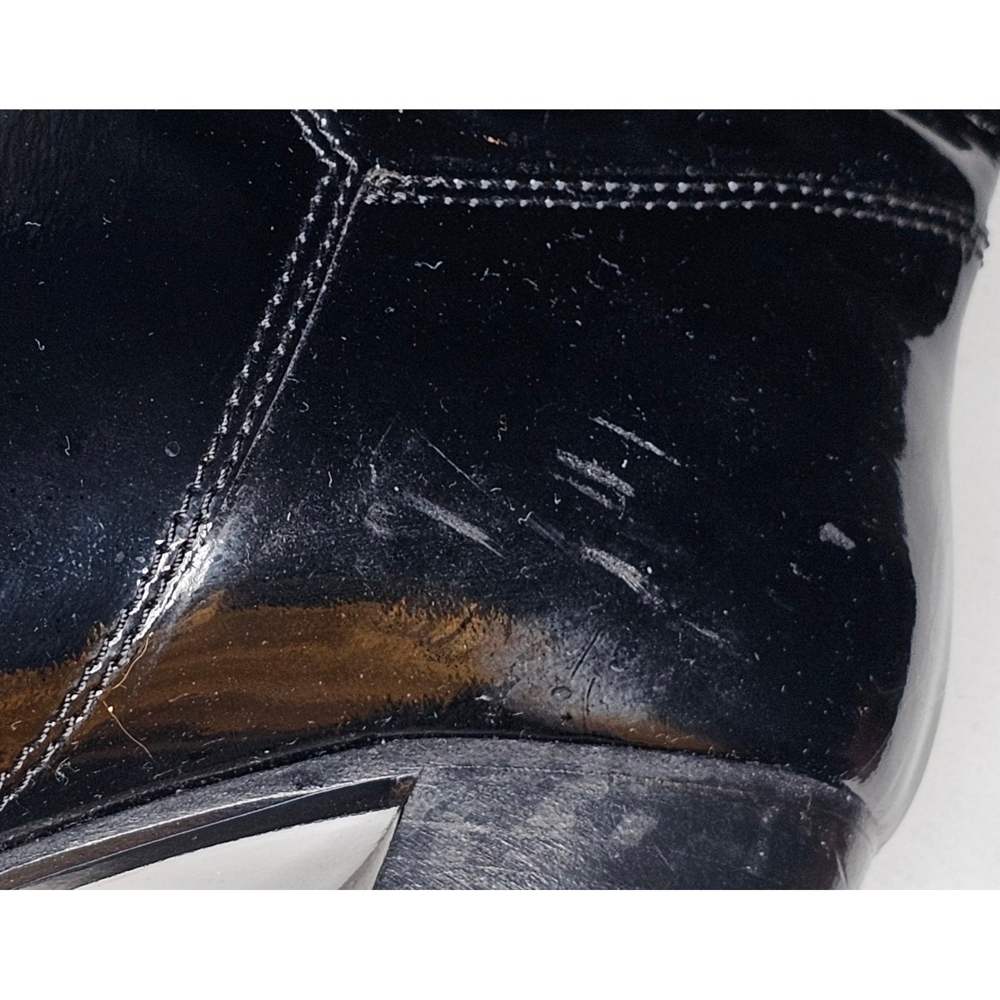 Chanel black patent leather boots with a chunky heel and embroidered CC logo