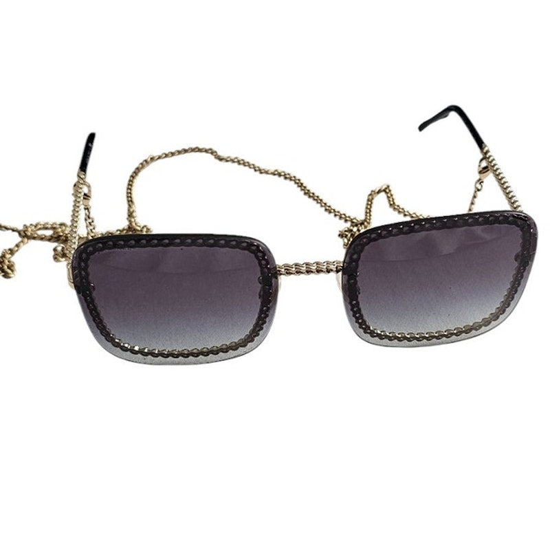Chanel CH4244 square metal frame sunglasses with a detachable gold-tone chain and grey gradient lenses
