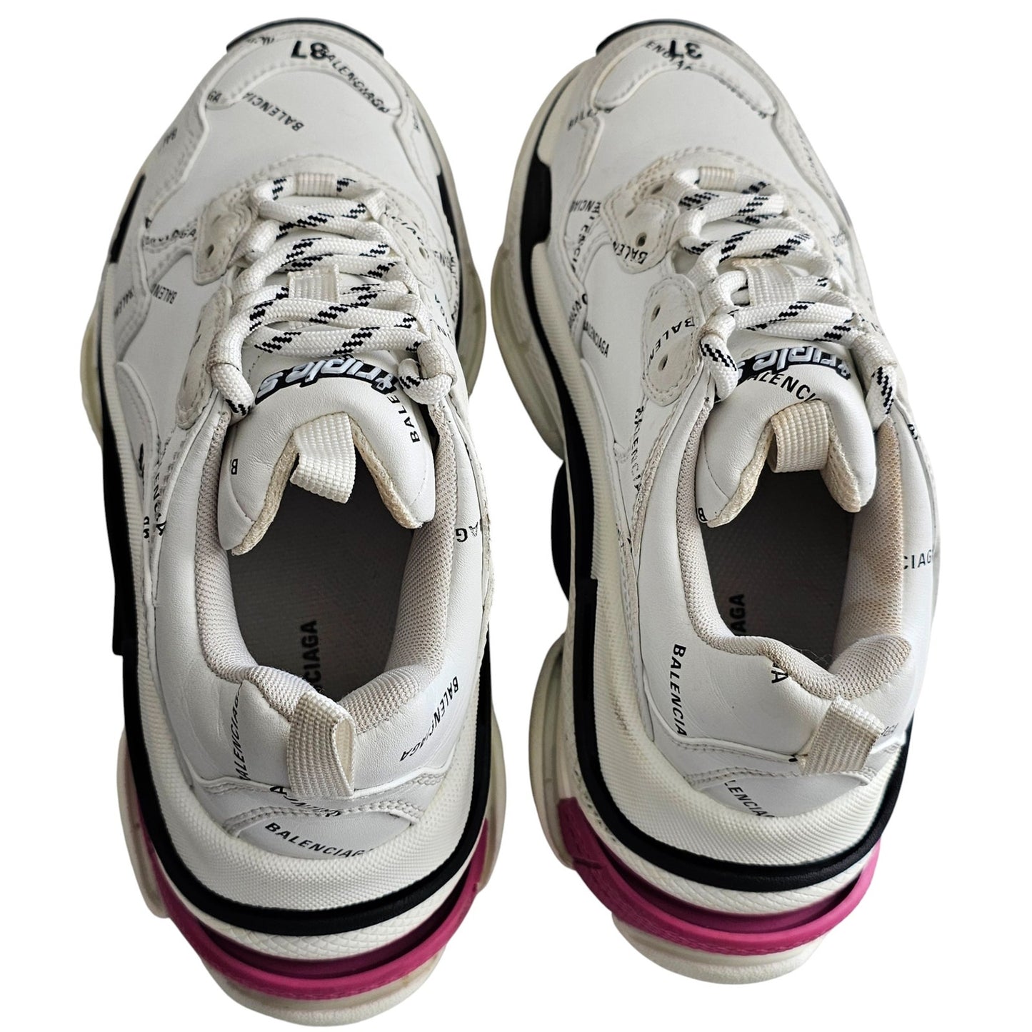 Balenciaga Triple S sneakers in white and black with pink accents and all-over logo detailing
