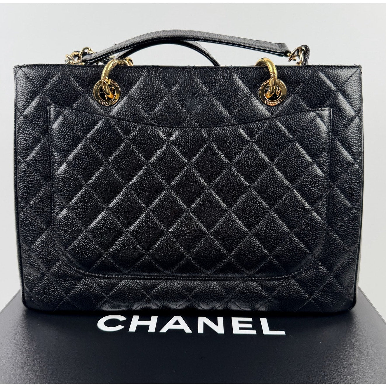 Chanel Grand Shopping Tote (GST) bag in black caviar leather with gold-tone hardware