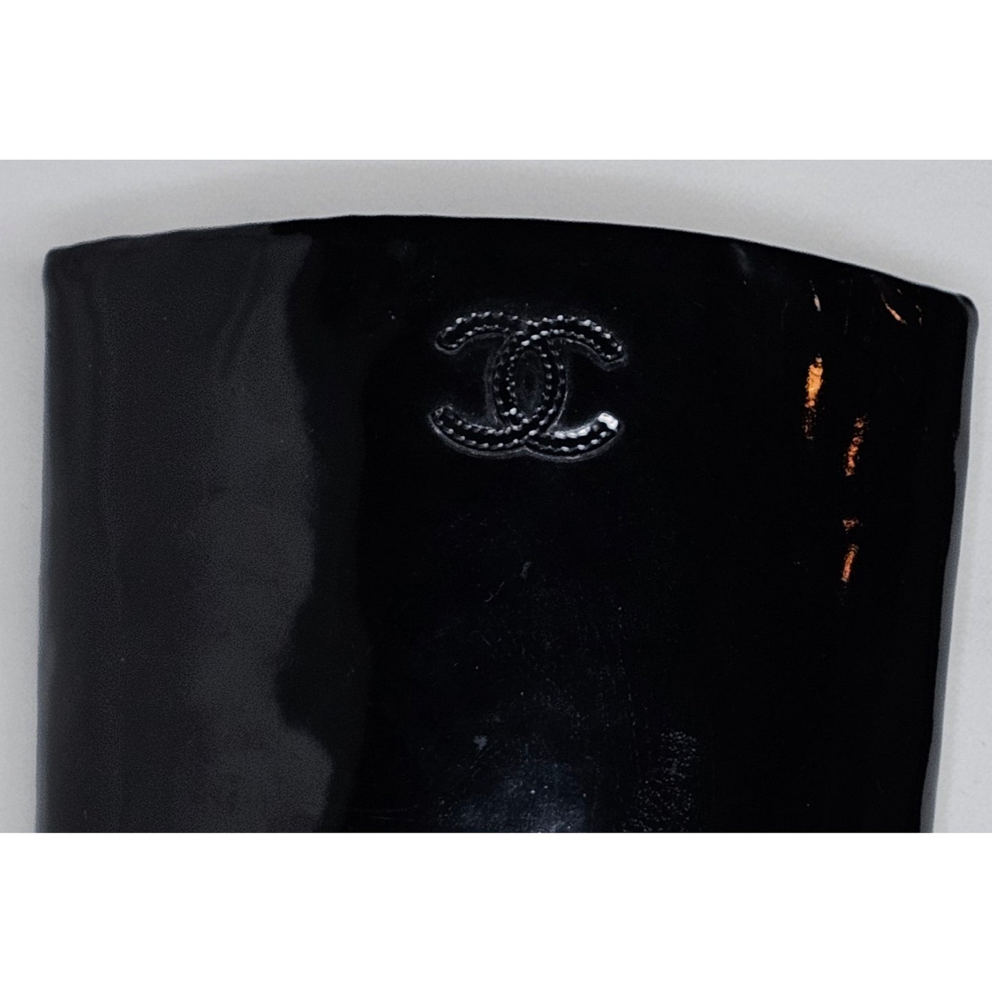 Chanel black patent leather boots with a chunky heel and embroidered CC logo