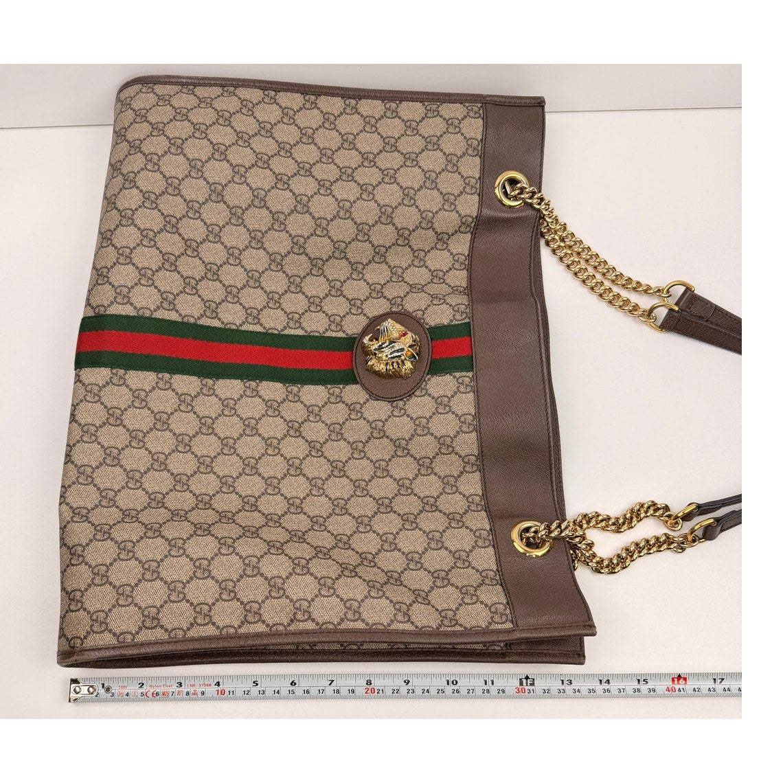 Gucci Rajah Large Tote Bag in GG Supreme canvas, featuring a tiger head detail and chain straps