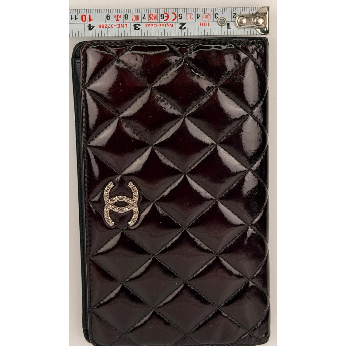 Chanel quilted patent leather long bifold wallet with a polished CC logo