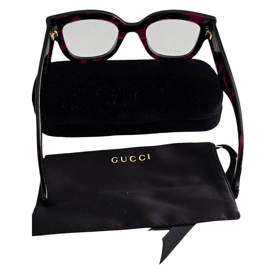 Gucci GG1423O cat-eye eyeglasses in a fuchsia havana color