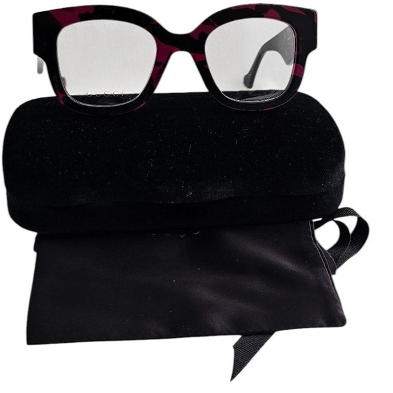 Gucci GG1423O cat-eye eyeglasses in a fuchsia havana color
