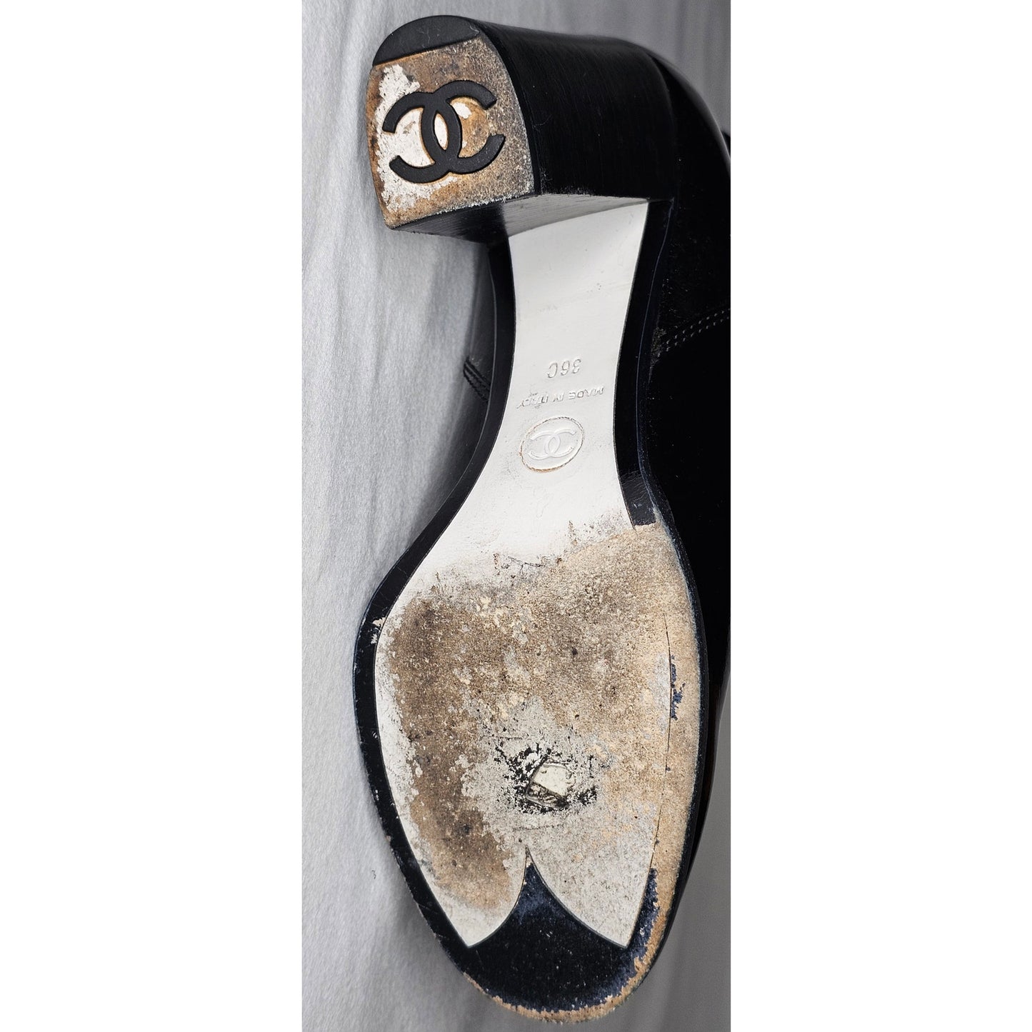 Chanel black patent leather boots with a chunky heel and embroidered CC logo