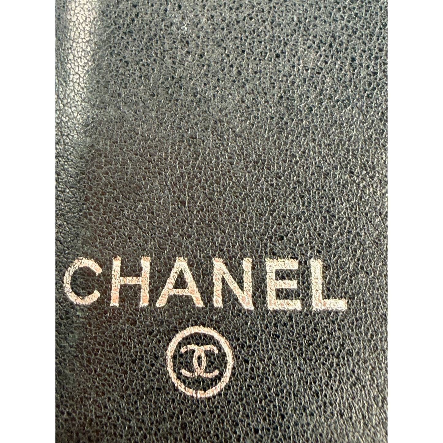 Chanel quilted patent leather long bifold wallet with a polished CC logo