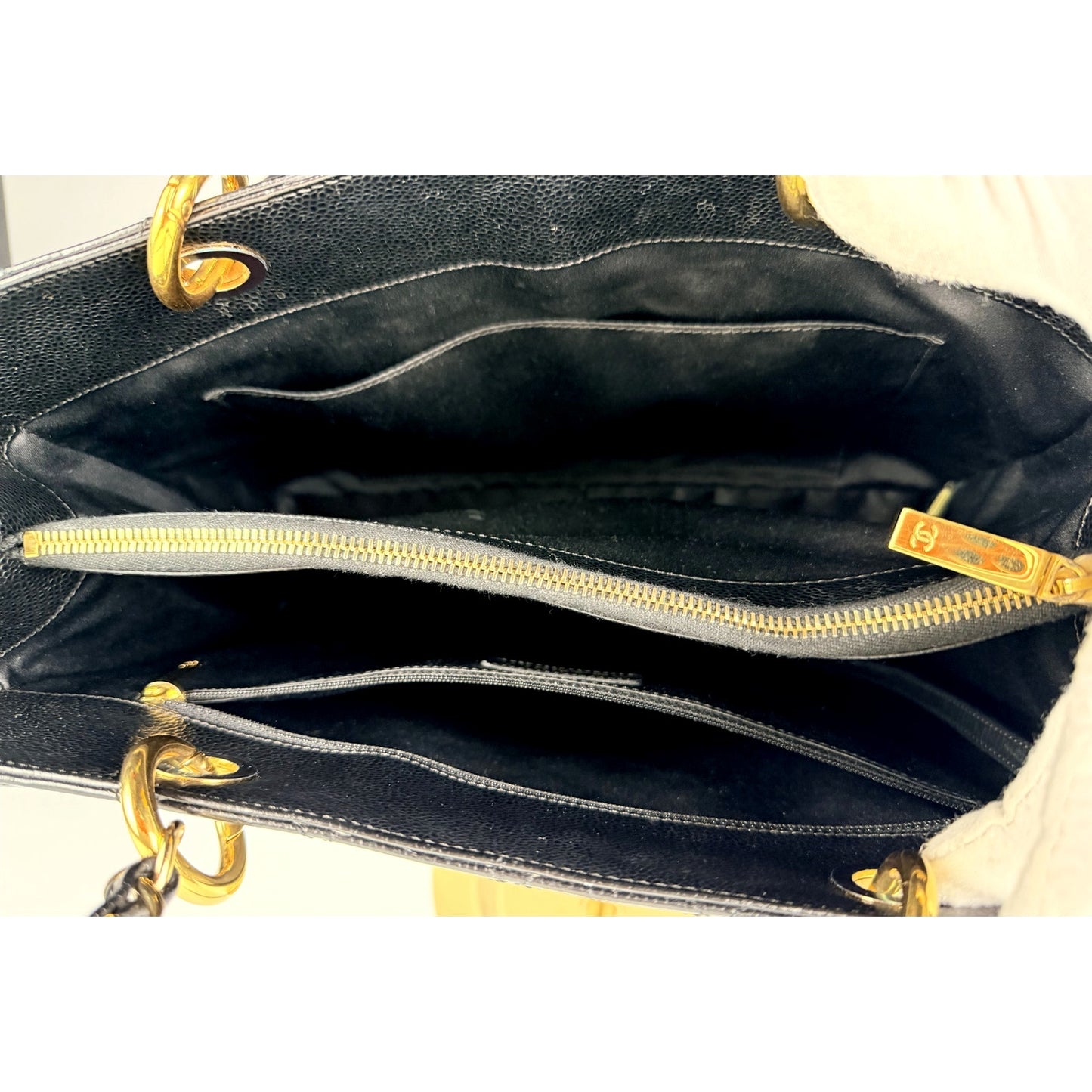 Chanel Grand Shopping Tote (GST) bag in black caviar leather with gold-tone hardware
