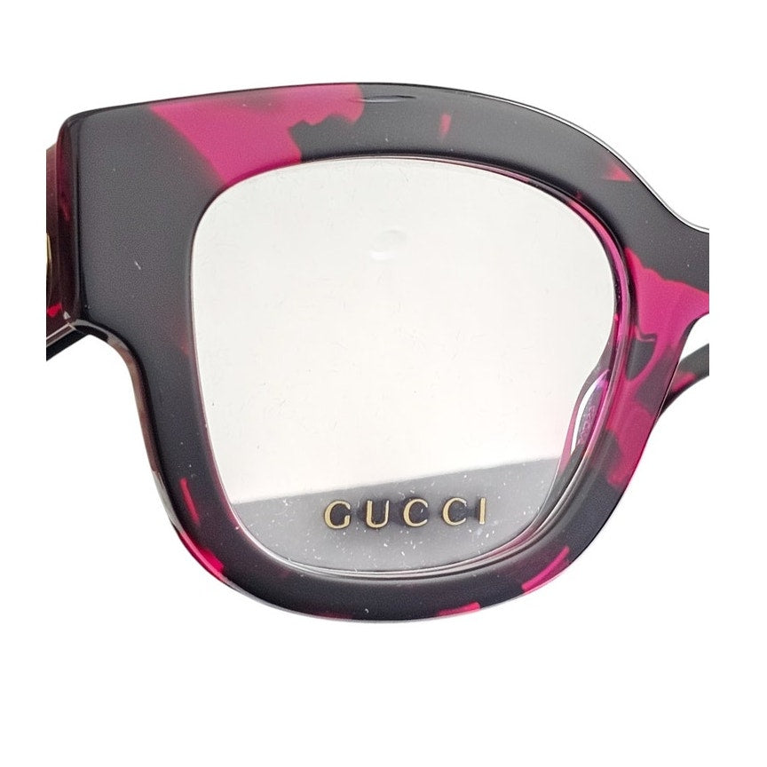 Gucci GG1423O cat-eye eyeglasses in a fuchsia havana color