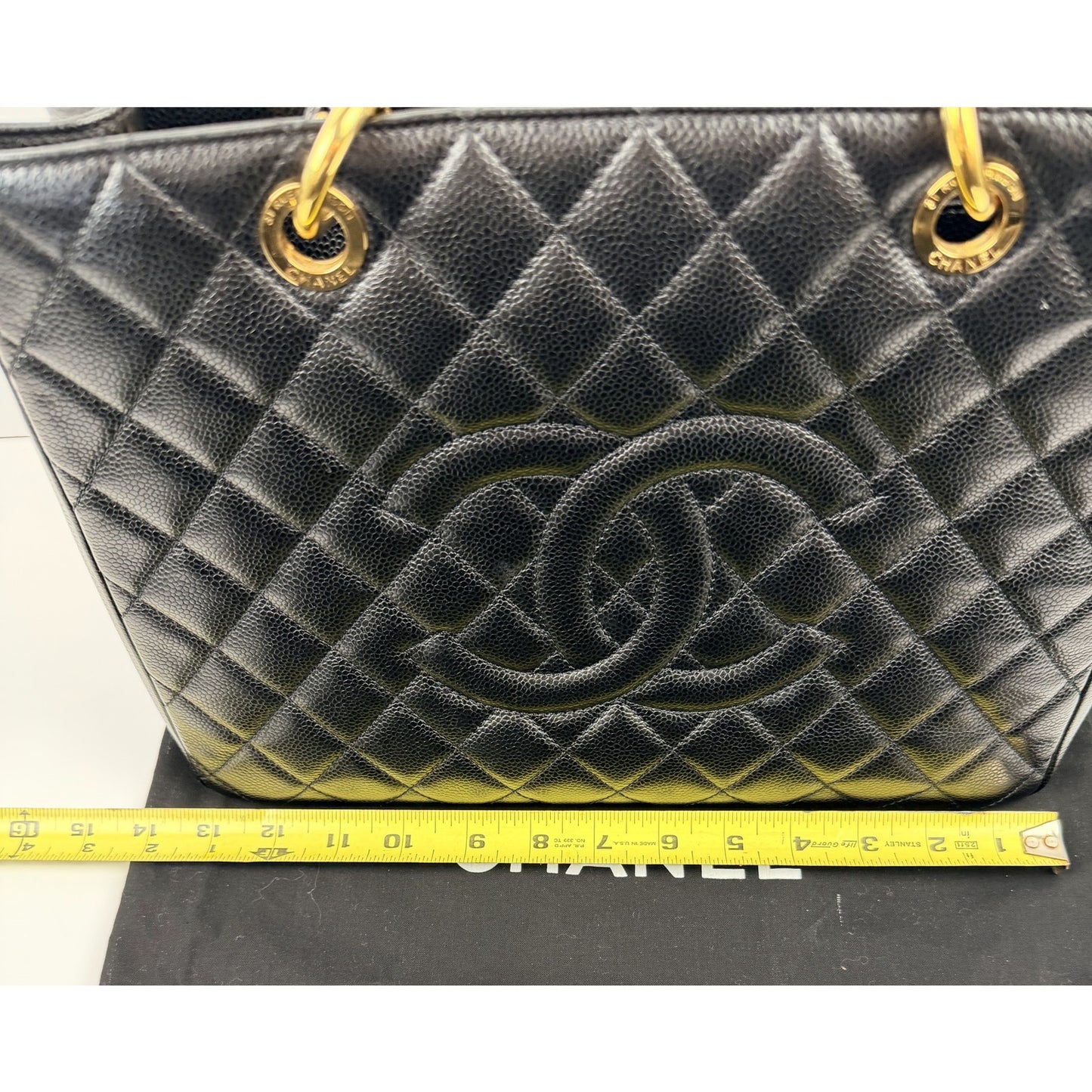 Chanel Grand Shopping Tote (GST) bag in black caviar leather with gold-tone hardware