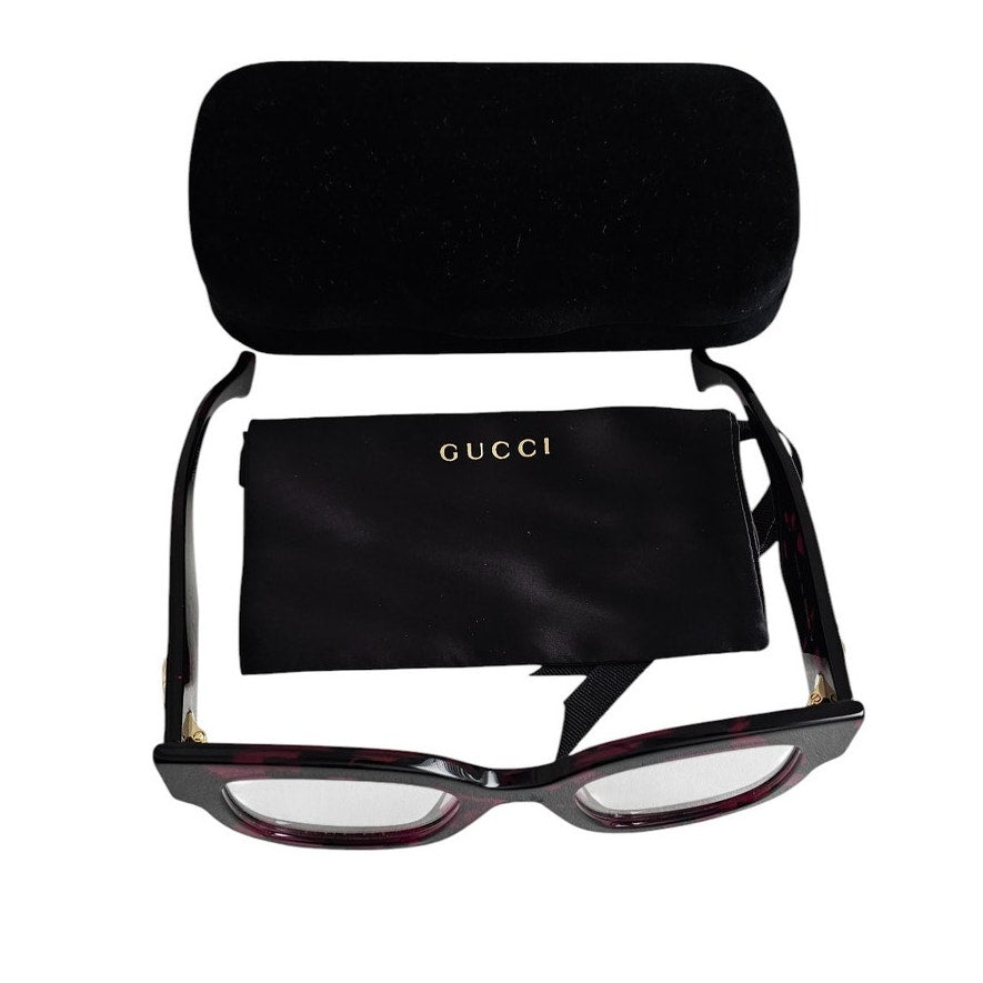 Gucci GG1423O cat-eye eyeglasses in a fuchsia havana color