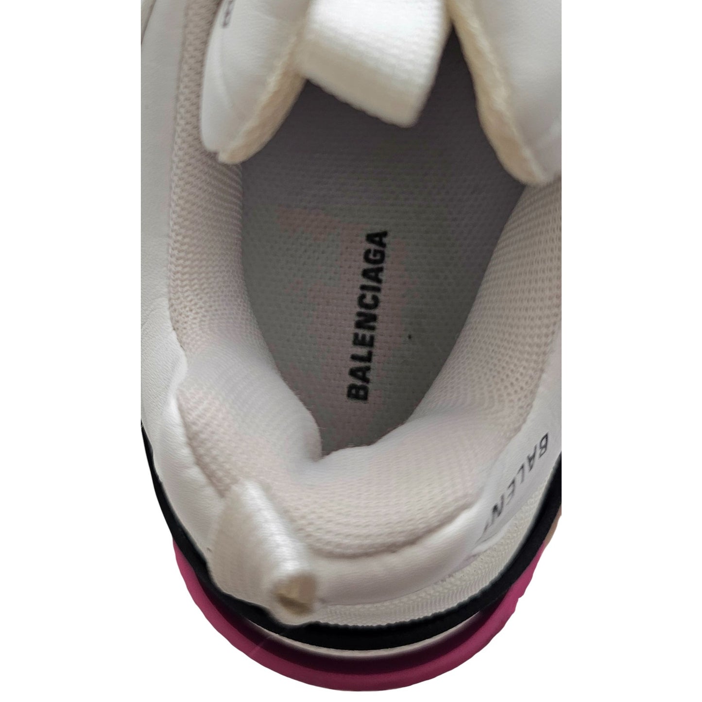 Balenciaga Triple S sneakers in white and black with pink accents and all-over logo detailing
