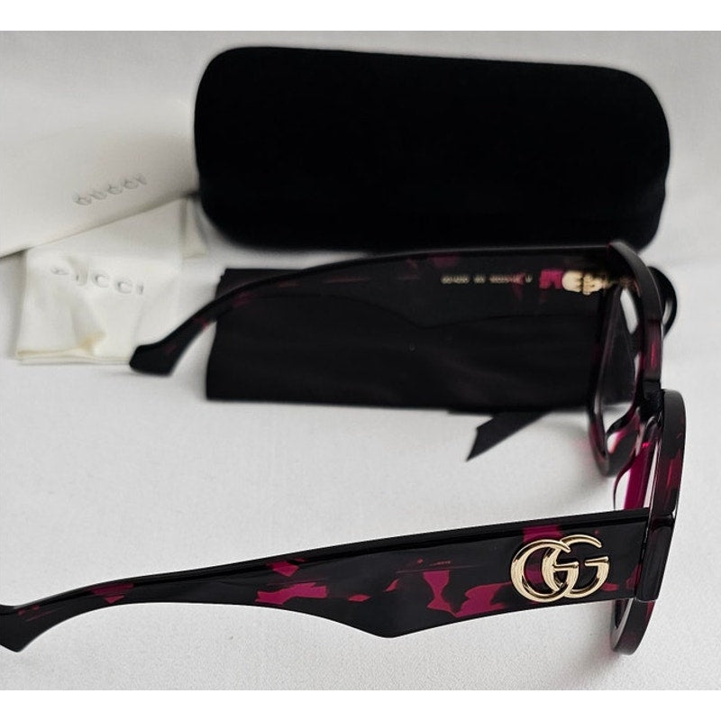 Gucci GG1423O cat-eye eyeglasses in a fuchsia havana color